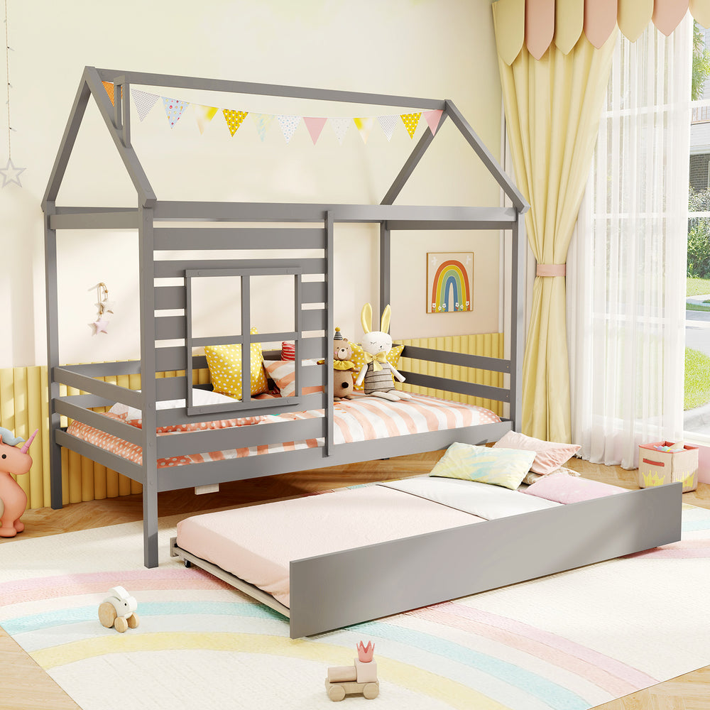 Twin size wooden platform house bed in grey with trundle, roof, and decorative window for a whimsical bedroom design.
