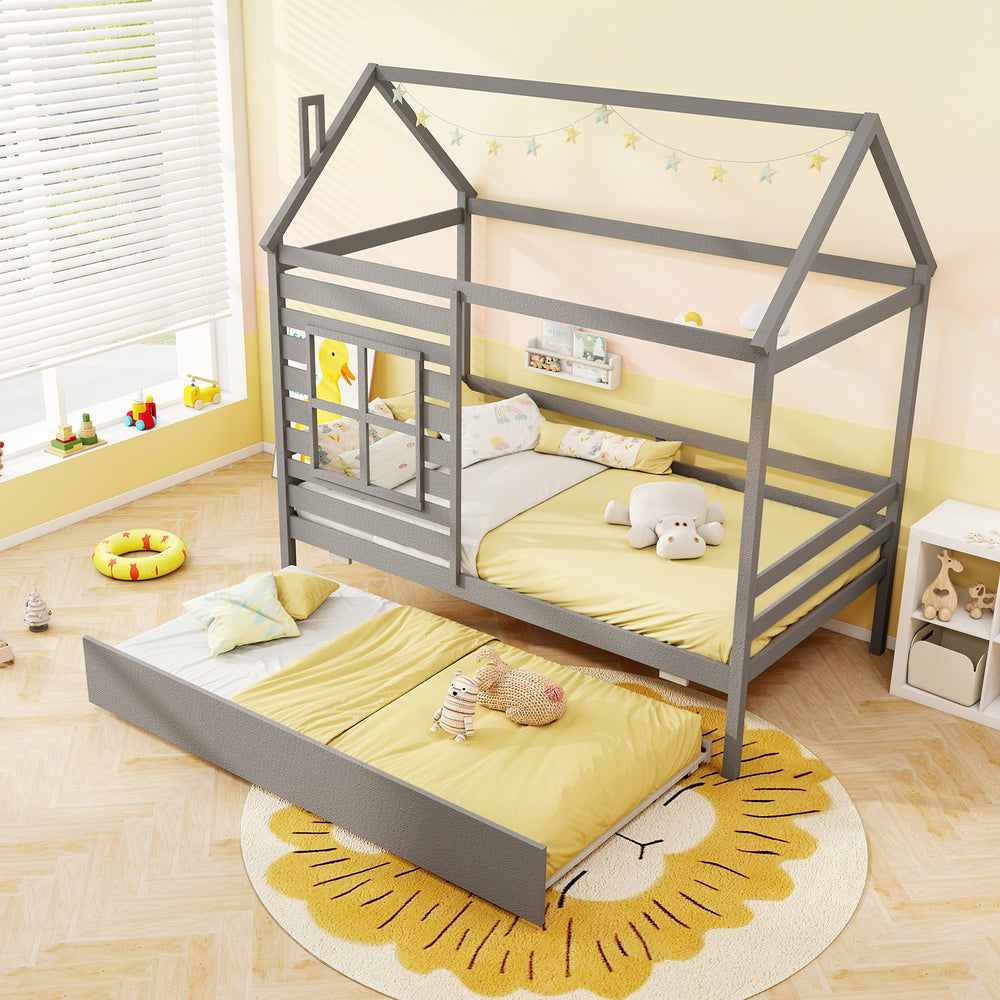 Twin size wooden platform house bed in grey with trundle, roof, and guardrails for safe and whimsical sleep.