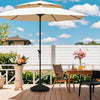 Water and sand filled outdoor umbrella stand in black with shell texture, designed for stability and easy movement.