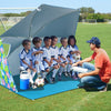 Portable beach umbrella tent in blue, 7.6 x 7 ft, with UPF50+ sun protection and zippered mesh windows for ventilation.