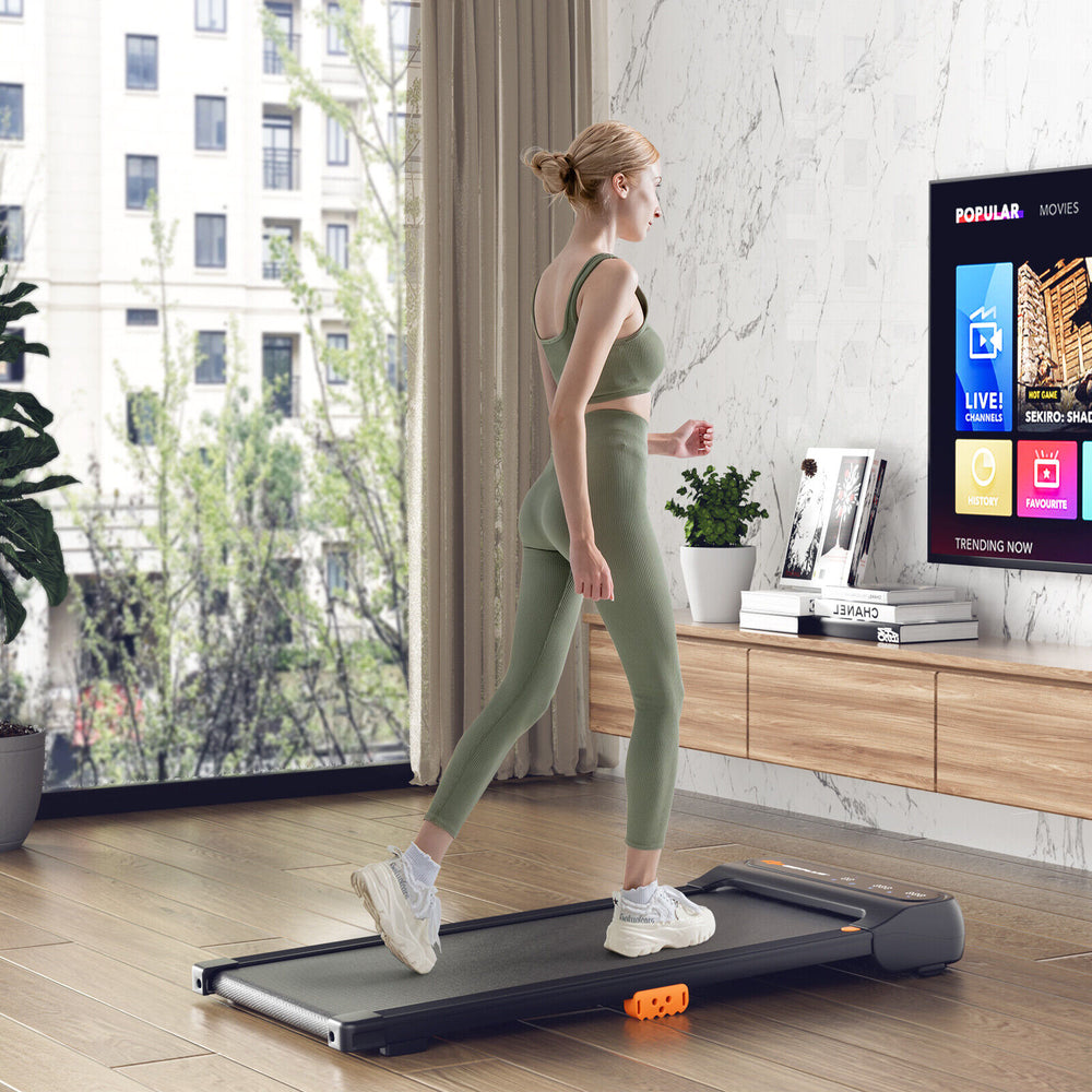 Under desk walking pad treadmill with LED touch screen, watch-like remote, and 7-layer running belt for home or office.