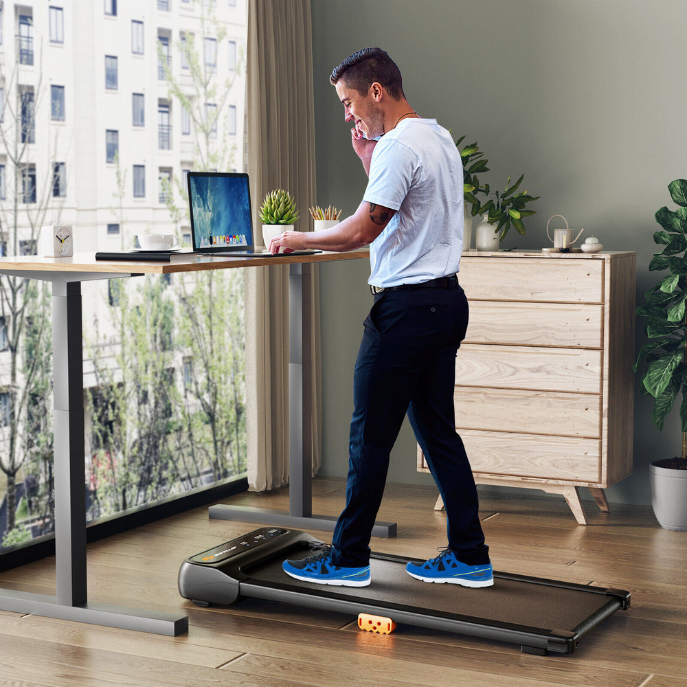 Under desk walking pad treadmill with remote control, featuring a 7-layer running belt and 14 shock absorbers for.
