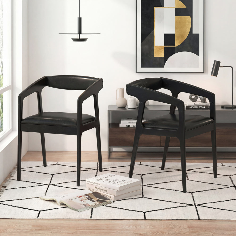Set of 2 black upholstered armchairs with cozy backrest and padded seat cushions, perfect for modern living spaces.