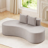 Curved upholstered sofa in gray with two cozy pillows, perfect for living rooms or offices, offering comfortable.