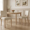 Upholstered dining chairs in beige with solid rubber wood legs, offering comfort and rustic style for dining rooms.