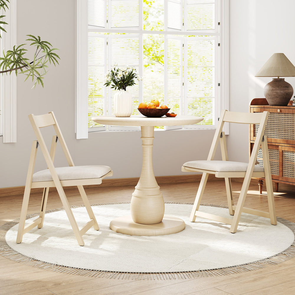 Folding upholstered dining chairs with curved backrests in beige, featuring soft cushions for comfort and easy storage.