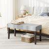 Upholstered gray entryway bench with padded seat and solid rubber wood legs, perfect for bedroom or living room storage.