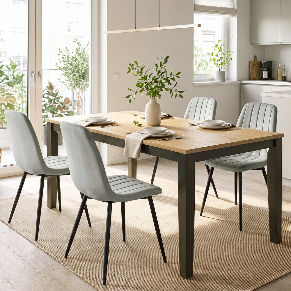 Gray upholstered dining chairs with sturdy metal legs and curved backrests, perfect for modern dining rooms and kitchens.