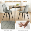Gray upholstered dining chairs with sturdy metal legs and curved backrest, ideal for dining rooms and kitchens.