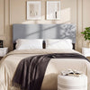 Upholstered gray headboard for queen/full size bed, featuring vertical quilted linen fabric and soft sponge cushioning.