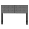 Upholstered headboard with adjustable width, featuring vertical channel tufting and solid rubber wood legs for enhanced stability.