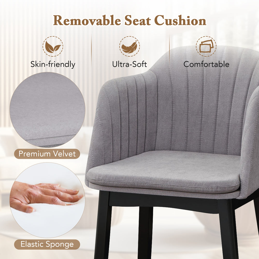 Curved backrest and soft seat cushion of grey upholstered velvet dining chair, ideal for dining and relaxation.