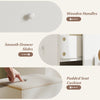 Wooden handles and smooth drawer slides on the white vanity desk with ample storage and padded seat cushion.