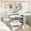 Vanity desk with mirror and lights in white featuring open shelves, large drawer, and cushioned stool for organized.