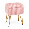 Plush pink vanity stool with storage and reversible lid, featuring sturdy metal legs for versatile use as a footrest or end table.