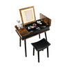 Vanity table set with flip-top mirror, LED lights, and cushioned stool, perfect for makeup and writing in rustic brown.