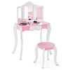 Kid's wooden vanity table and stool set with a 3-panel acrylic mirror, featuring a pull-out drawer for storage.