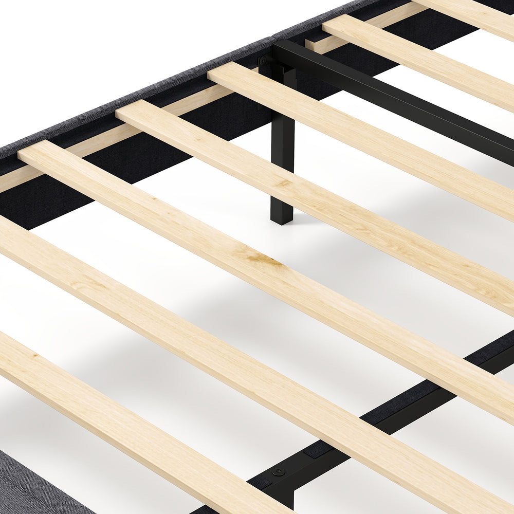 Close-up of wooden slats on a velvet upholstered platform bed frame with adjustable headboard for enhanced support.