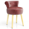 Pink velvet vanity chair with tufted low back and solid wood legs, designed for comfort and elegance in any space.