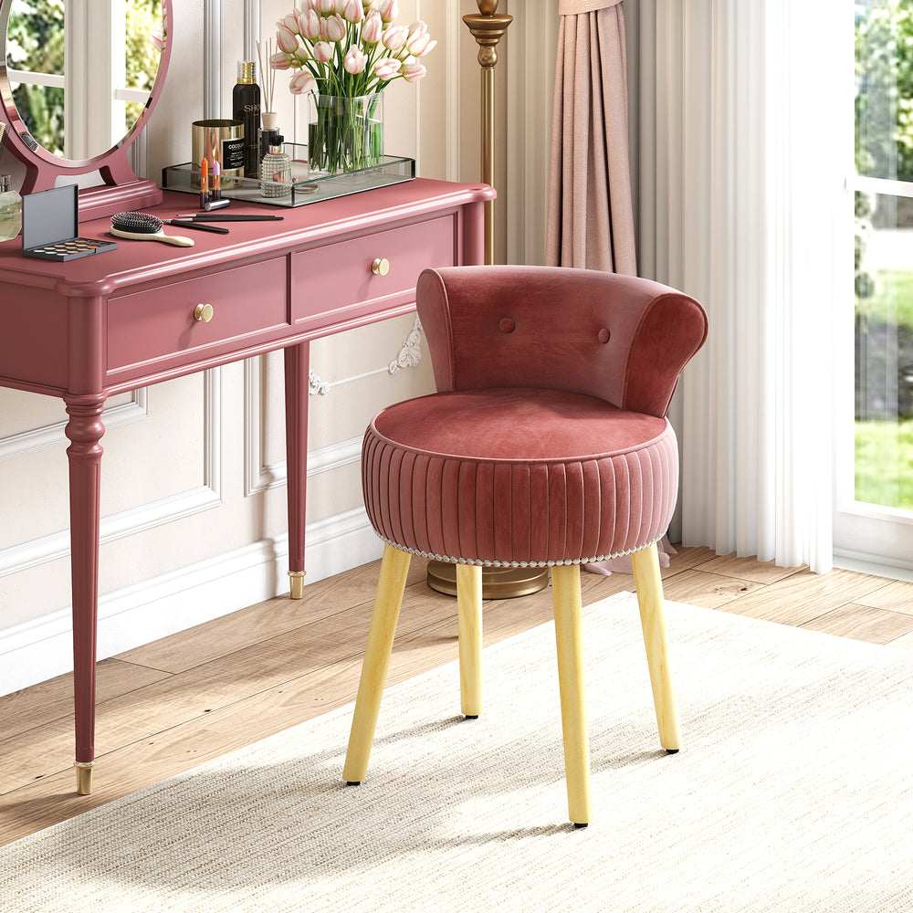 Velvet vanity chair in pink with tufted low back and solid wood legs, perfect for elegant dressing tables.