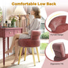 Velvet vanity chair in pink with tufted low back, curved design, and solid wood legs for stylish makeup application.