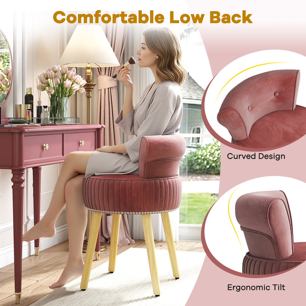 Velvet vanity chair in pink with tufted low back, curved design, and solid wood legs for stylish makeup application.