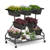 Vertical raised garden bed with 7 black planter boxes and 2 storage baskets, ideal for plant growth and easy mobility.