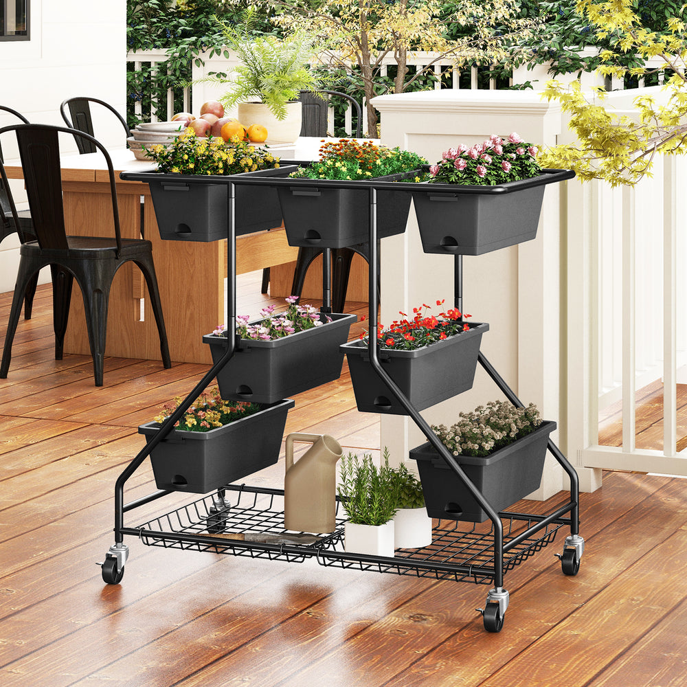 Vertical raised garden bed in black with 7 planter boxes and 2 storage baskets, perfect for outdoor plant display.