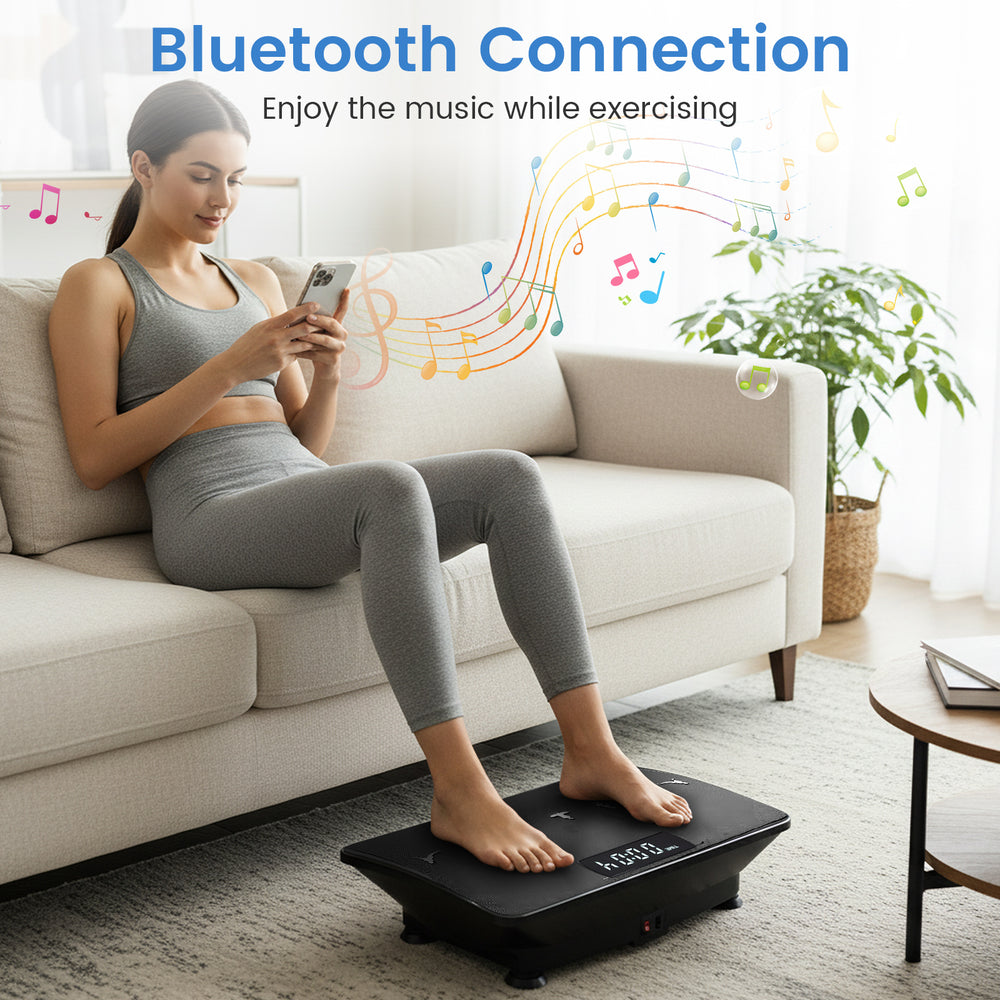 Vibration plate exercise machine in black with a user on a sofa, showcasing Bluetooth connection for music while.