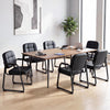 Set of two black leather office reception chairs with cushioned seats and ergonomic backrests for comfort in a meeting.