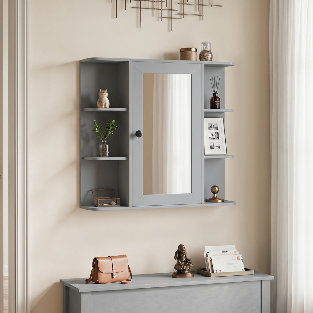 Gray wall-mounted bathroom medicine cabinet showcases a mirrored door, rounded corners, and six open shelves for stylish storage.