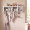 Wall-mounted coat rack in white with 4 cubbies and 5 double hooks, perfect for organizing entryways and kitchens.