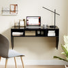 Wall-mounted black computer desk with 3 storage compartments, featuring a spacious surface for laptops and monitors.