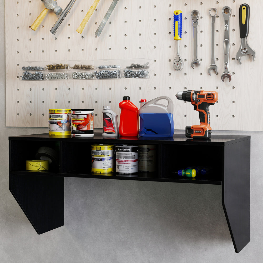 Wall-mounted black computer desk with three storage compartments, ideal for organizing workspace and saving floor space.