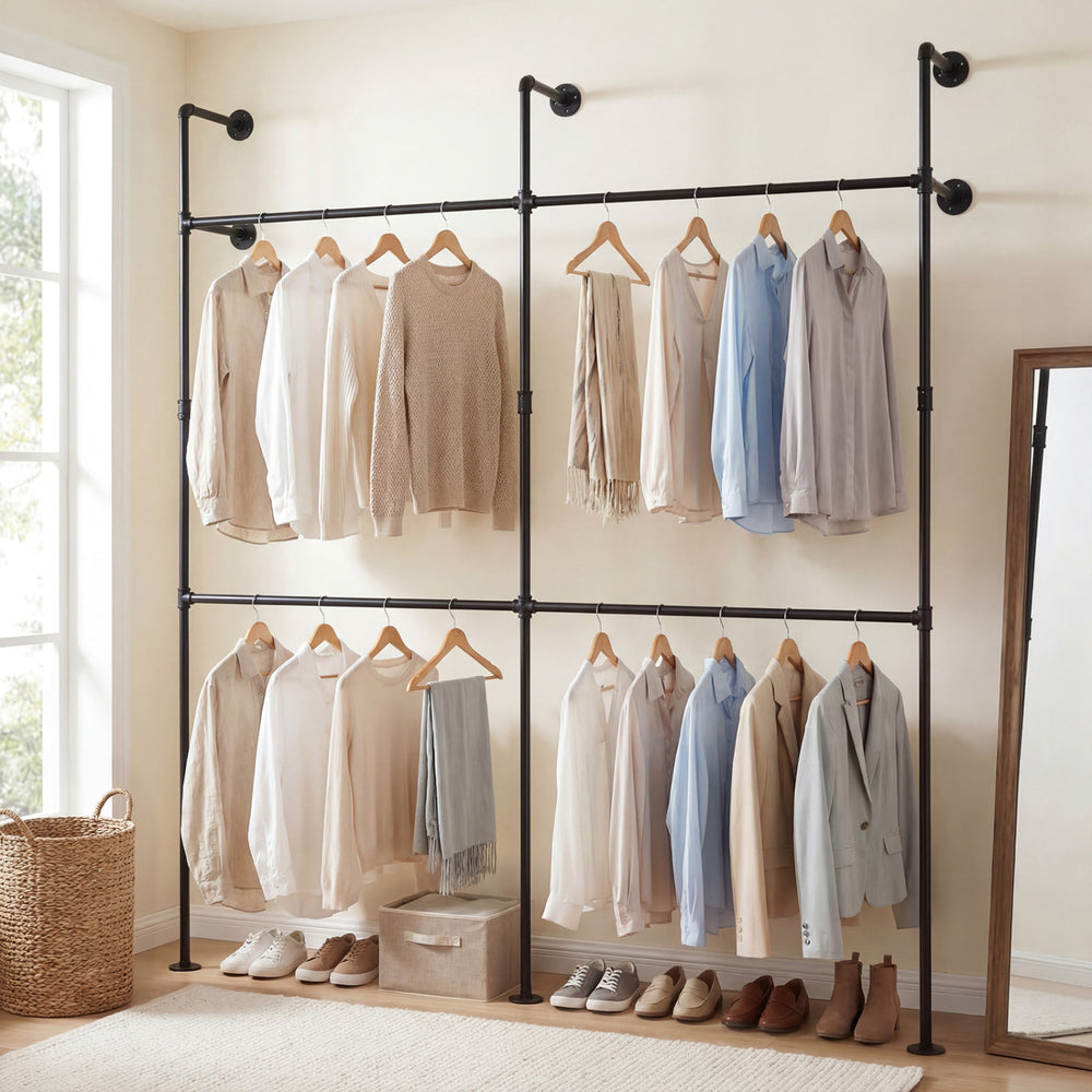 Wall-mounted black pipe clothing rack with four hanging rods, featuring a double-tier design for organized storage.