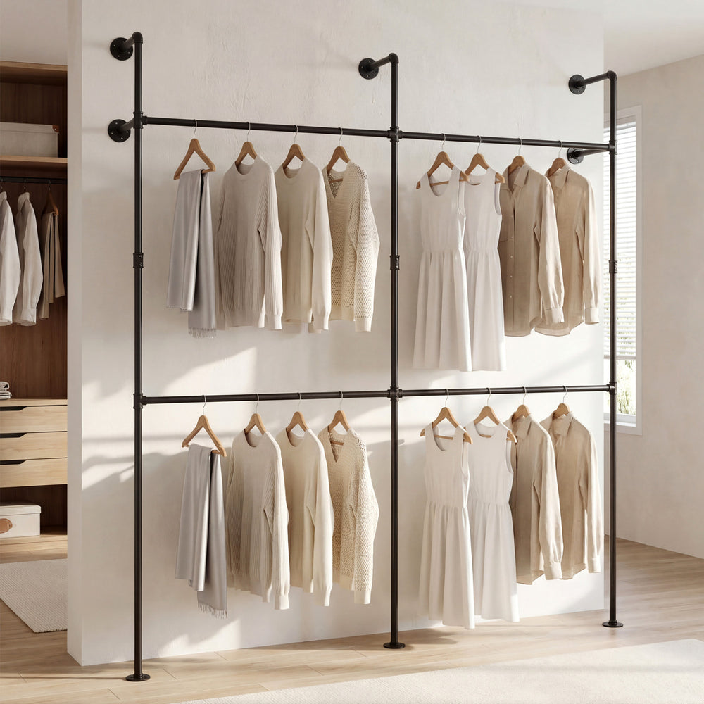 Wall-mounted black clothing rack with four hanging rods, featuring a double-tier design for organized storage.