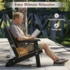 Black HDPE folding Adirondack chair with high backrest and cup holder, perfect for backyard relaxation and comfort.
