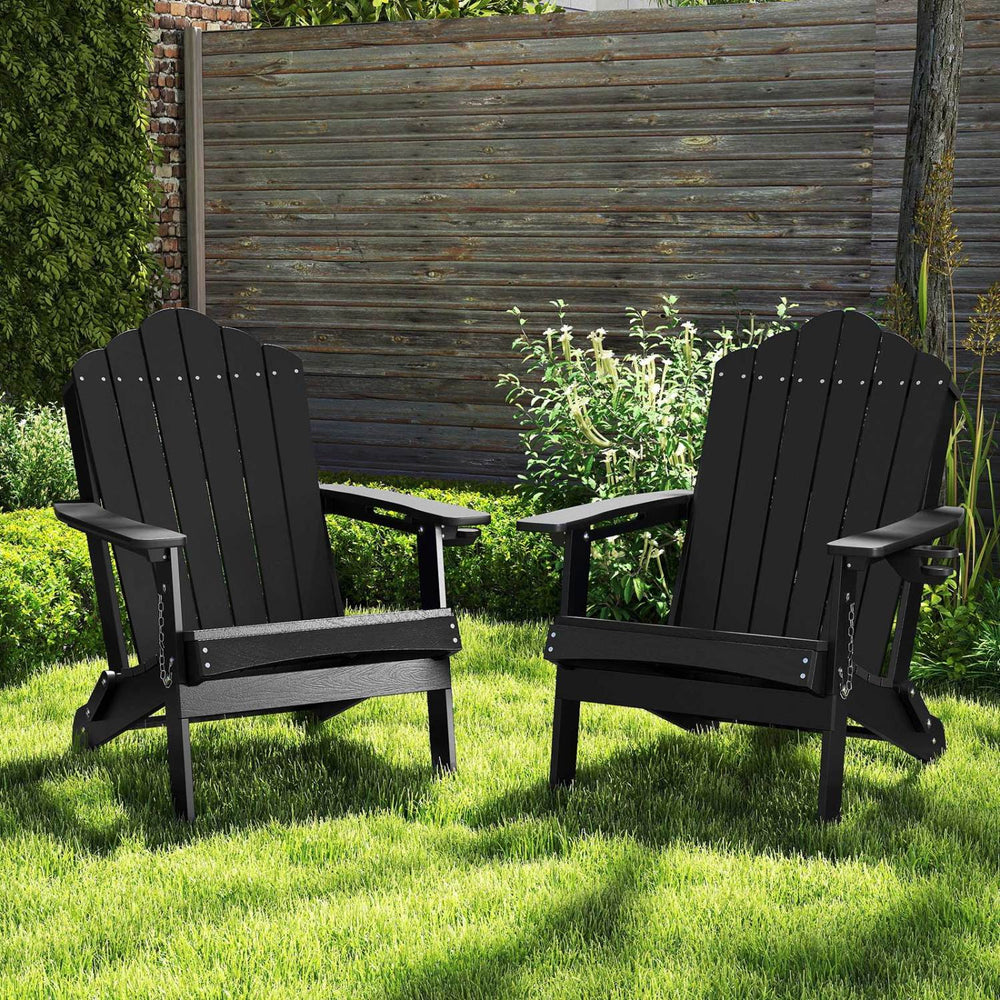 Two black weather-resistant HDPE folding Adirondack chairs with high backrests, perfect for backyard relaxation and comfort.