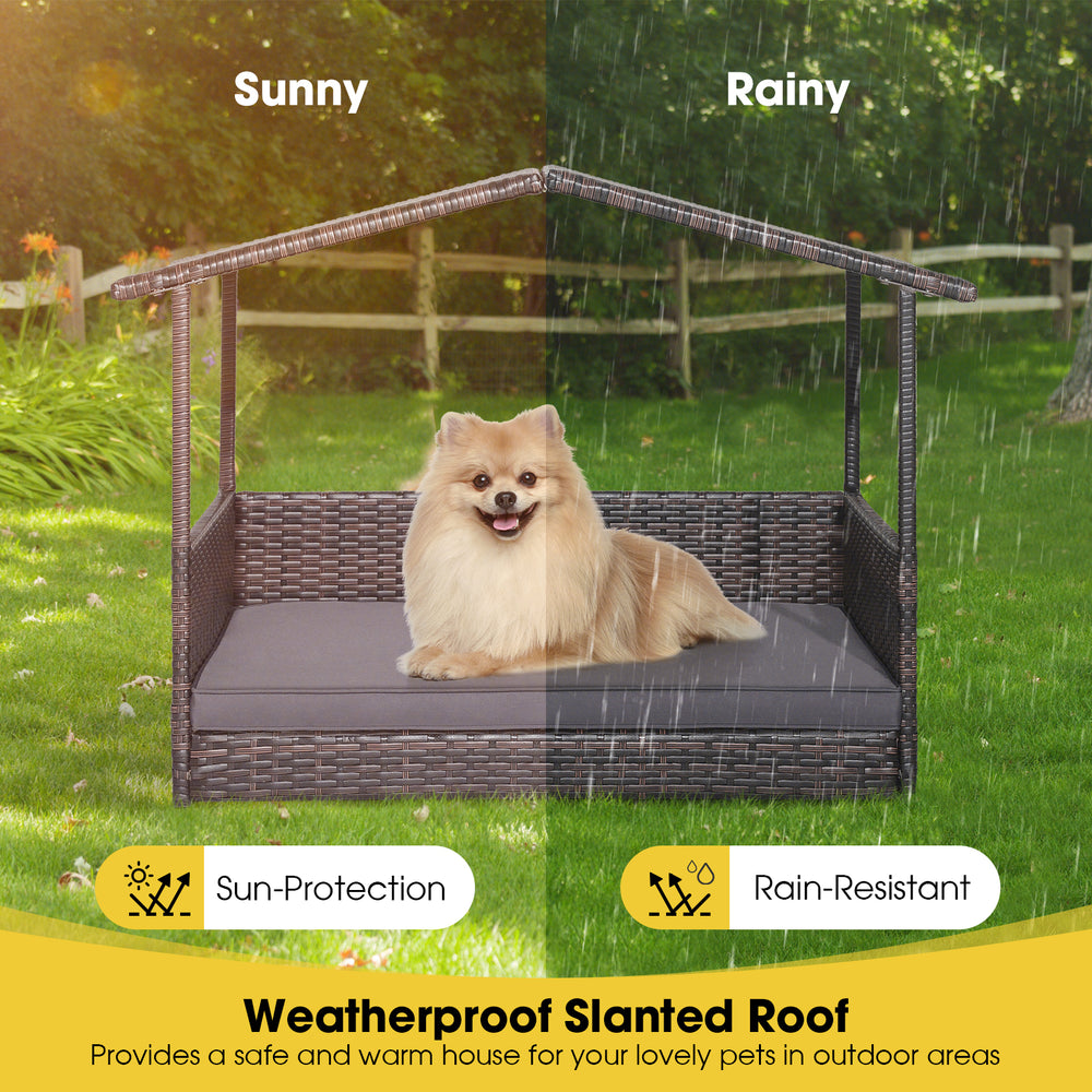 Outdoor wicker dog house with weatherproof slanted roof, featuring a comfortable cushion for pets in all weather.