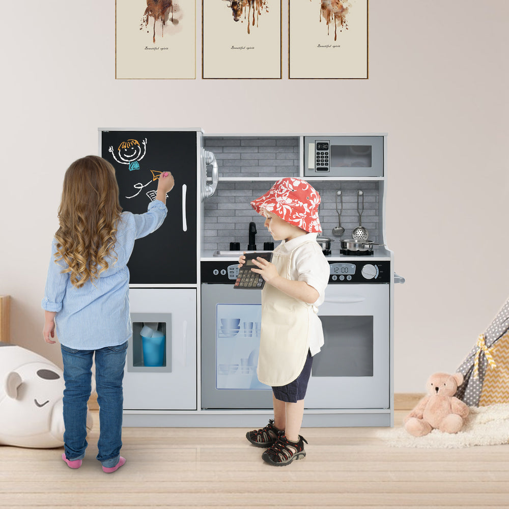 Kids engaging with the toddler pretend play kitchen in white, featuring a blackboard and realistic appliances for.