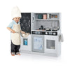 Toddler pretend play kitchen in white with removable sink, stove, and accessories for imaginative cooking fun.