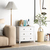 Three-drawer white dresser chest with modern design, perfect for bedside storage and easy access to essentials.