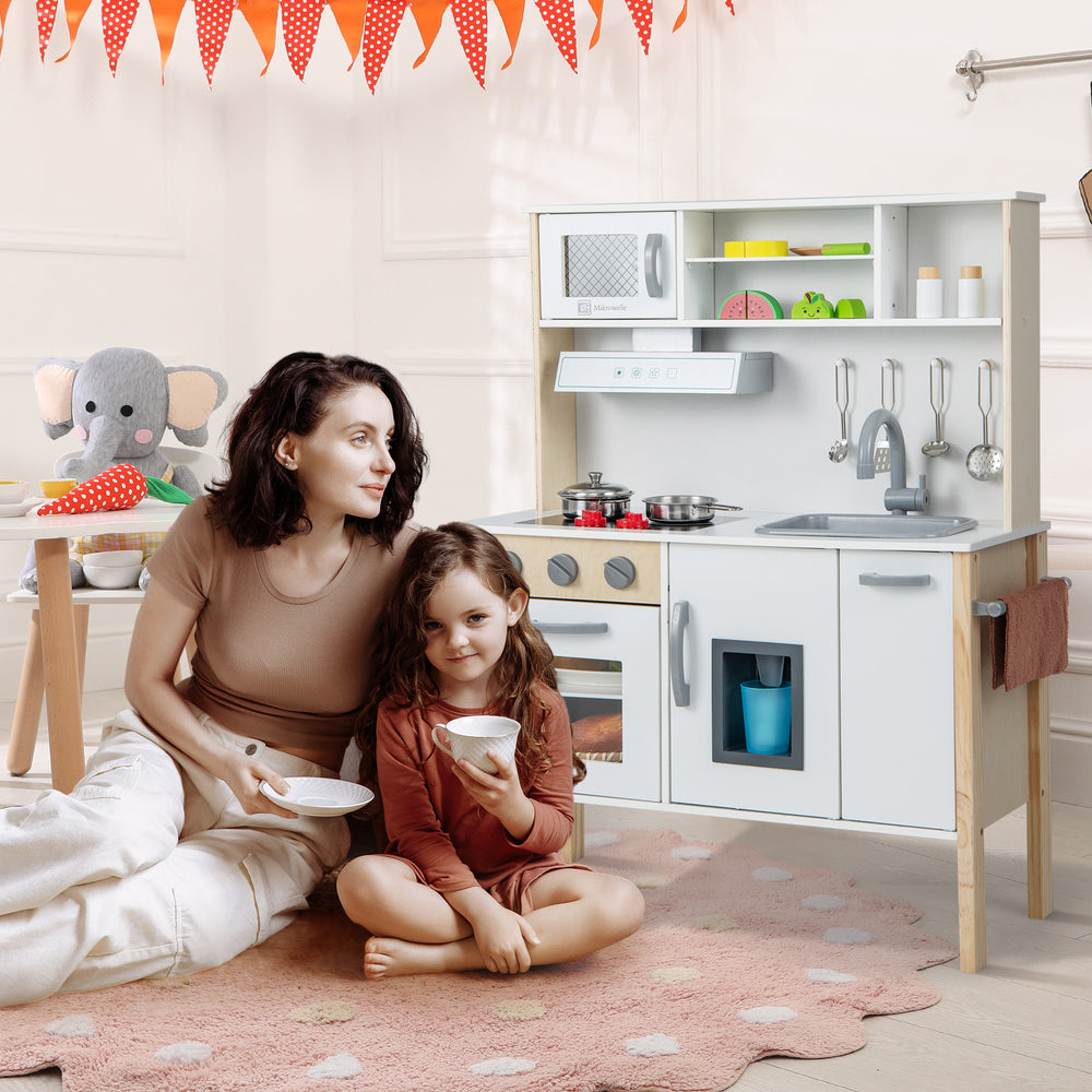 Wooden pretend play kitchen set for toddlers in white, featuring a microwave, sink, and cooking accessories for.