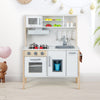 Wooden pretend play kitchen set for toddlers in white, featuring a sink, stove, and storage for imaginative play.