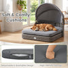 Wicker dog house with adjustable canopy and two detachable gray cushions for small to medium dogs, ideal for outdoor lounging.