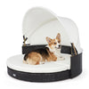 Wicker dog house with a spacious round design, featuring a retractable canopy and soft cushion for ultimate relaxation.