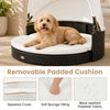 Wicker dog house with retractable canopy and removable padded cushion, ideal for indoor and outdoor relaxation.
