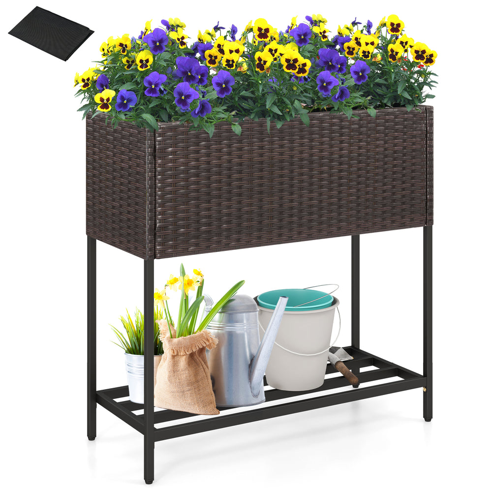 Wicker raised garden bed with removable liner, featuring a storage shelf for tools and vibrant flowers, ideal for.