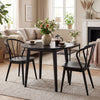 Set of 4 black Windsor dining chairs with spindle backrest, featuring rubber wood construction for stability and.