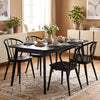 Set of four black Windsor dining chairs with spindle backrest, featuring rubber wood construction for stability and.